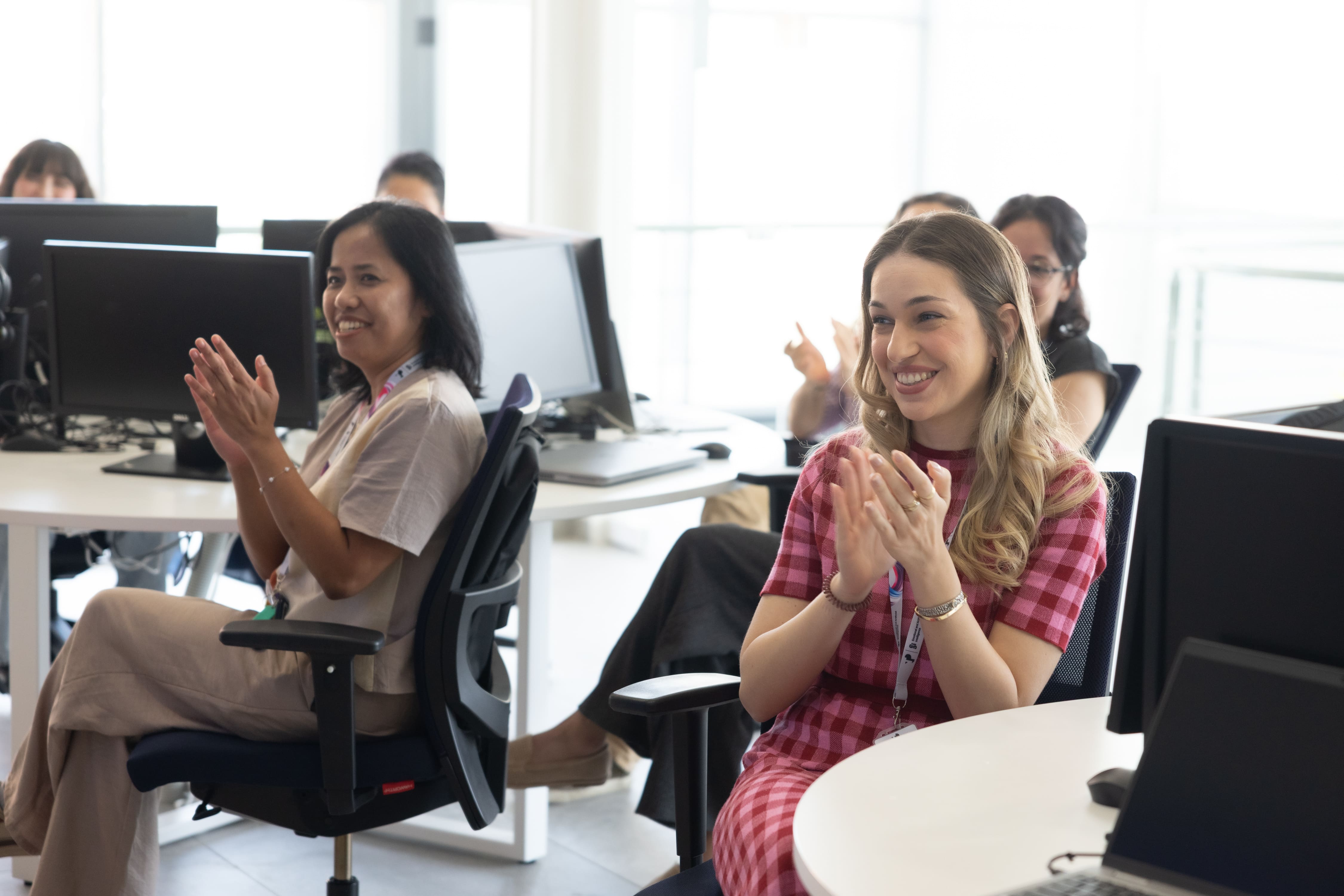 Woman clapping during training