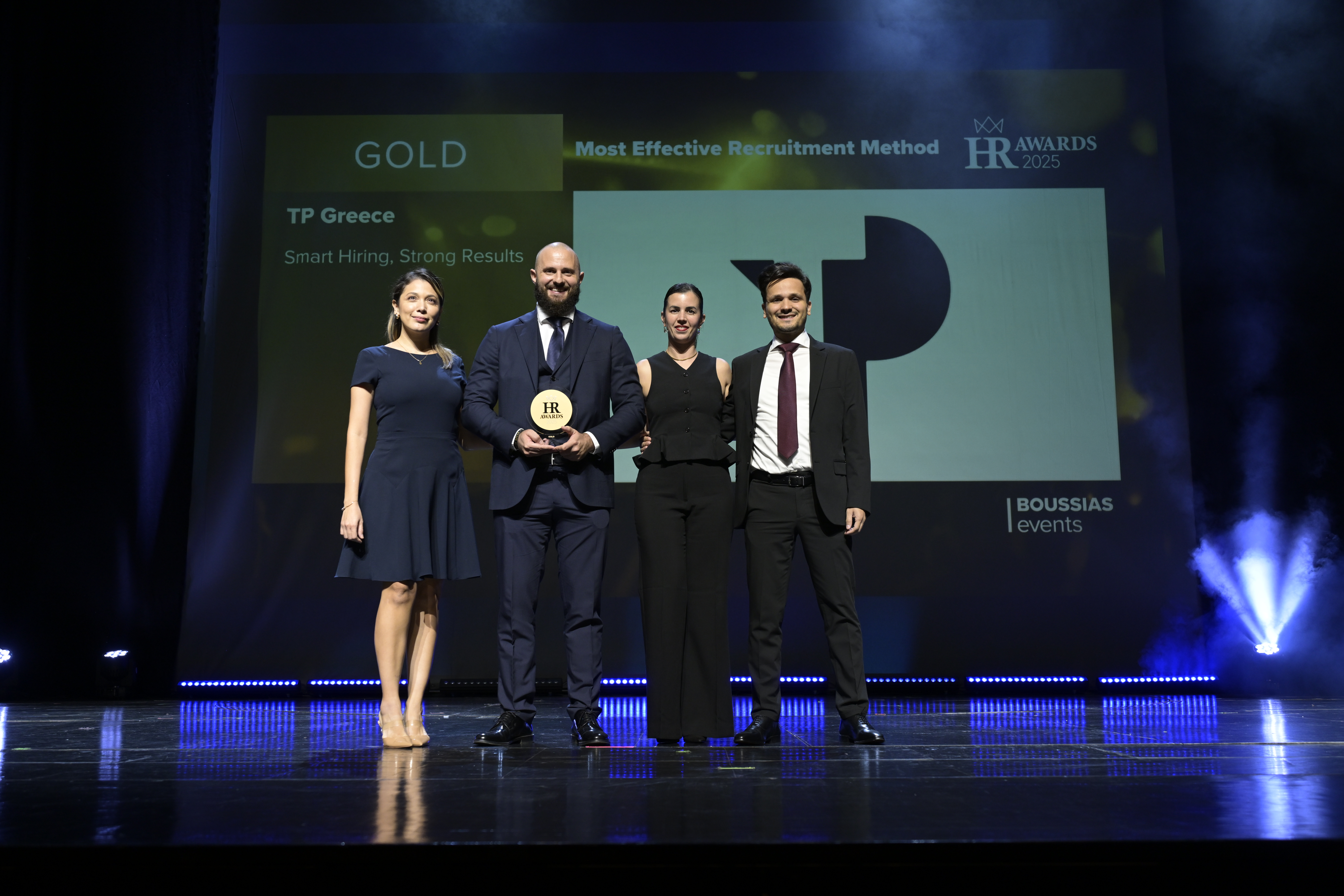 TP Greece's Recruitment Team on stage, receiving the Gold Award for Most Effective Recruitment Method, at the 2025 HR Awards by BOUSSIAS.