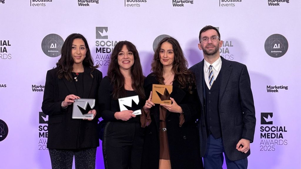 The digital marketing team of TP in Greece holding 3 trophies at the digital marketing awards 2025