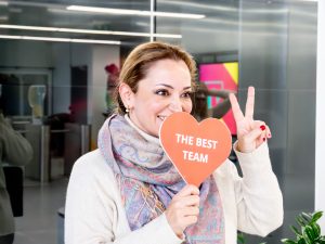 girl holding heart sign at TP Carnival event 2026