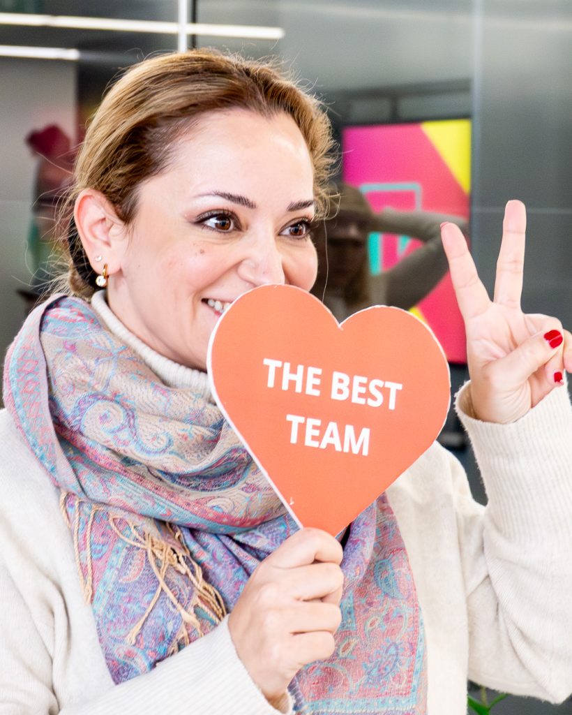 girl holding heart sign at TP Carnival event 2026
