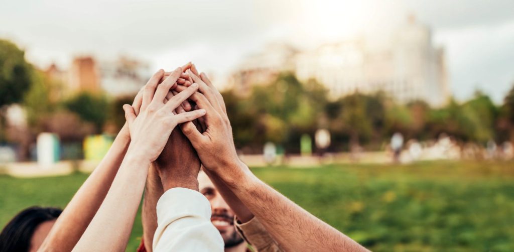 health wellbeing team hands